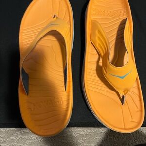 Orange Hoka Flip Flop Sandals with Blue Accent